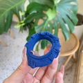 Detail of a navy blue ribbed fabric scrunchie showcasing its soft texture and elasticity - Sapphire Blue