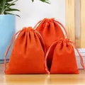 Three-piece set of orange velvet drawstring jewelry gift pouches in various sizes - Orange