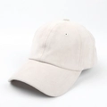 Close-up detail of a cream faux suede baseball cap with stitched eyelets and curved brim - Off White / Adjustable