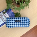 Detailed view of large lake blue plaid woven pencil case with Sozakka brand label on desk - Blue Checkered Pencil Case