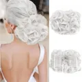 Detail view of curly white synthetic hair bun with dual side combs for bridal styling - White