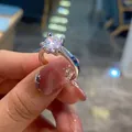 Close-up of a silver ring featuring a large round-cut diamond in a four-prong setting - TJZ195-Four-Prong Hollow Engraved