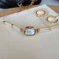 Elegant gold oval watch with double-strand pearl bracelet and mother-of-pearl dial - White Dial Gold Case