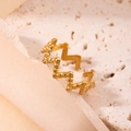 Minimalist gold titanium ring with hammered texture and wavy adjustable design - Hammered Wave