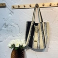Knitted tote bag with black and white stripes and handmade metal tag on the side - Black and White Vertical Stripes