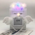 Detailed view of white feather angel halo headband with colorful LED lights and small wings - White Angel LED Colored Lights