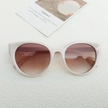 Occhiali da sole chic cat-eye con montatura beige e lenti sfumate marroni per donna - Bianco Sporco
