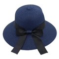 Detail of blue straw sun hat featuring a wide brim and a large black satin bow ribbon - Kids One Size Head Circumference 52cm / Navy Blue