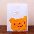 White plastic gift bag with orange bear print and smile quote, thick handheld shopping bag - 20x27cm / Smiling Bear