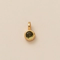 Golden round pendant featuring an olive green zircon gemstone on beige texture - Round August Pendant (Olive Green)