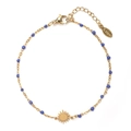 Detail of gold stainless steel bracelet with blue enamel beads and sun charm pendant - Dark Blue
