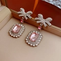 Macro shot of silver bow earrings with pink rectangular zircon and sparkling rhinestones - Earrings (Silver Needle-Pink-Silver)