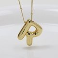 Detail of a puffy gold bubble letter P pendant with a shiny metallic finish and thin chain - Letter R (Necklace)