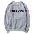 Unisex grey hoodie with black Freedom print and American flag sleeve badge, flat lay view - Light Gray