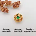 Macro shot of 9mm gold hollow bead with green cat-eye stone for DIY jewelry making - Style 13