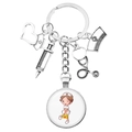 Nurse-themed silver keychain featuring syringe, stethoscope, and cartoon nurse pendant - Cartoon Nurse Medical Box