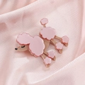 Elegant pink poodle brooch in layered resin finish on a soft pink satin fabric background - Pink