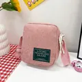 Pink corduroy square crossbody bag with embroidered patch and adjustable fabric strap - Pink
