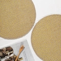 Round beige jute placemat with yellow floral woven pattern and decorative tassels - 38cm / Gold Lotus