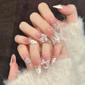 Handgefertigte Kunstnägel mit cremeweißem French Cat-Eye-Design und 3D-Schleifen - XS / Langes Oval (3194)