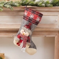Christmas stocking gift bag with a plush snowman doll on a red and black plaid fabric - Snowflake Plaid Snowman Stocking