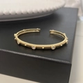 Adjustable gold open bangle with vertical textures and six sparkling zircon accents - Brushed Textured