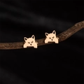 Chic rose gold stainless steel cat stud earrings displayed on a rustic branch background - 749 Rose Gold