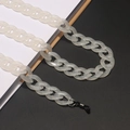 Detail of translucent white acrylic eyeglass chain with secure rubber loops on a notebook - 22 Milky White