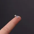 Triangle zircon cartilage stud in stainless steel held between fingers for size - Single Triangular Zircon (HSPJ356-17#) / Silver
