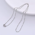 Detail of silver chain necklace with white beads and lobster clasp on white surface - Steel - White Beads