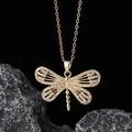 Detailed close-up of golden dragonfly pendant necklace with white zircon pavé setting - Style D-Gold Hollow Mesh Pave