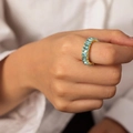 Golden geometric ring with rectangular light blue zircon stones worn on finger - Blue A