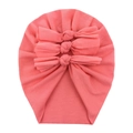 Detail of coral pink baby turban hat featuring triple-layered bows and soft cotton fabric - Pink Red