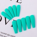 Macro detail of matte tiffany blue press on nails in long ballet shape on magazine base - Teal Blue