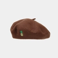Detail of pineapple embroidery on caramel wool beret showing fine stitching and texture - One Size / Dark Brown