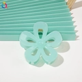 Macro detail of mint green floral hair claw clip made of premium acrylic material - 7cm Hollow Flower - Mint Green