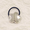 Silver flower alloy hair tie with black elastic cord for women on beige paper - Silver Chunky Star 5cm