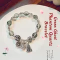 Ethnic green phantom crystal beaded bracelet with vintage silver fortune bag charm - Peony Flower: Green Ghost Crystal Bracelet