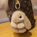 Brown fluffy mink fur rabbit charm with golden keychain ring on a designer bag - 8cm / Khaki