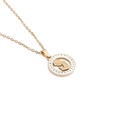 Macro detail of golden Mother's Day necklace with rhinestone heart and silhouette - Gold Rhinestone Mother Child Style
