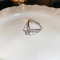 Detail of silver bow ring with heart motif, lustrous pearl and shimmering zircon stones - Heart Shape Silver Pearl Ring (27#)