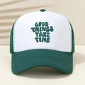 Detail of Good Things Take Time logo on a green and white mesh trucker hat - Dark Green