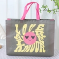 Dark grey non-woven tote bag with pink handles and yellow LOVE text print - Rose Red Smiley