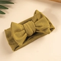 Detail of mustard yellow knitted pointelle baby headband with a large layered bow - Army Green