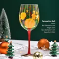 Hand-painted Christmas wine glass with yellow ornaments and red stem for holiday decor - Christmas Baubles