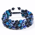 Macro shot of double-row evil eye beads and natural tiger eye stone with adjustable cord - Blue Tiger Eye + Obsidian + Evil Eye Bracelet
