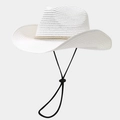 Detail of white straw cowboy hat showing woven texture and decorative beaded gold band - White