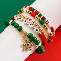 Macro di set bracciali natalizi con ciondolo a fiocco di neve e perline rosse verdi - Bracciale Fiocco di Neve
