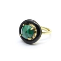 Detail view of round faceted malachite and black onyx stones set in a gold metal ring band - Malachite