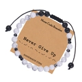 Detail showing Morse code bead pattern on a braided white turquoise friendship bracelet - Never Give Up